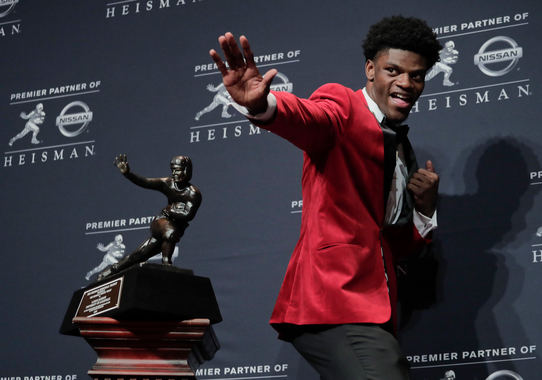 Louisville's Lamar Jackson poses with the Heisman Trophy after winning the Heisman Trophy award Saturday, Dec. 10, 2016, in New York. (AP Photo/Julie Jacobson)